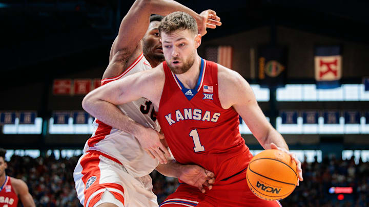 Mar 8, 2025; Lawrence, Kansas, USA; Kansas Jayhawks center Hunter Dickinson (1) drives to the basket during the second half against the Arizona Wildcats at Allen Fieldhouse. Mandatory Credit: William Purnell-Imagn Images
