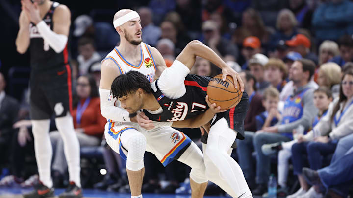 Nov 20, 2024; Oklahoma City, Oklahoma, USA; Oklahoma City Thunder guard Alex Caruso (9) defends Portland Trail Blazers guard Shaedon Sharpe (17) during the second half at Paycom Center. Mandatory Credit: Alonzo Adams-Imagn Images Nov 20, 2024; Oklahoma City, Oklahoma, USA; Oklahoma City Thunder guard Alex Caruso (9) defends Portland Trail Blazers guard Shaedon Sharpe (17) during the second half at Paycom Center. Mandatory Credit: Alonzo Adams-Imagn Images