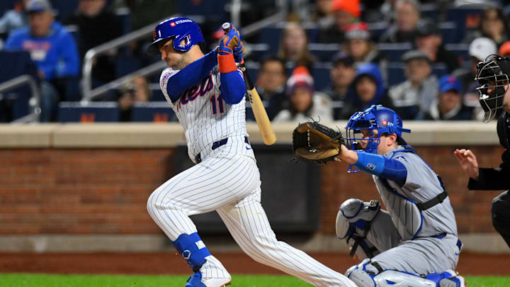 Oct 17, 2024; New York City, New York, USA; New York Mets second base Jose Iglesias (11) hits a single in the second inning during game four of the NLCS for the 2024 MLB playoffs at Citi Field. 