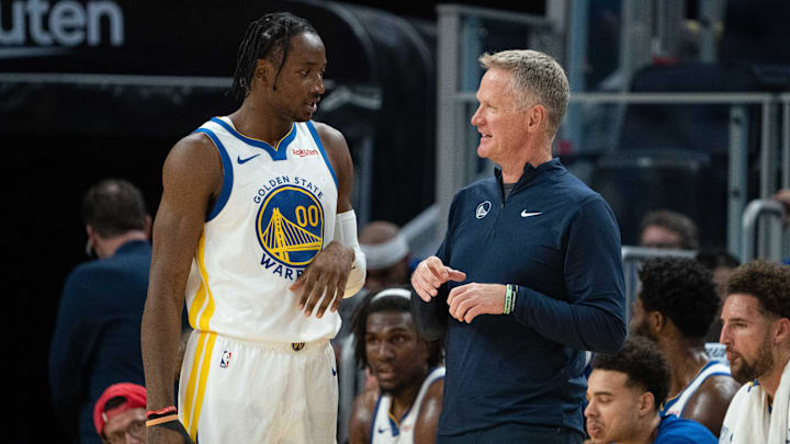 October 20, 2023; San Francisco, California, USA; Golden State Warriors head coach Steve Kerr (right) talks to forward Jonathan Kuminga (00) during the third quarter against the San Antonio Spurs at Chase Center. Mandatory Credit: Kyle Terada-Imagn Images