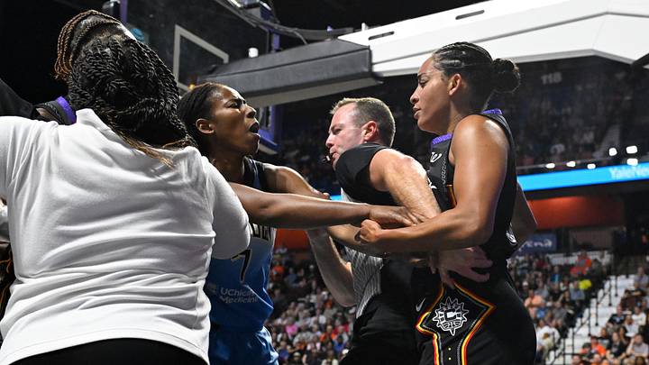 Aug 13, 2025; Uncasville, Connecticut, USA; Chicago Sky guard Ariel Atkins (7) advances on Connecticut Sun guard Bria Hartley (14) both players were ejected from the game  during the first half at Mohegan Sun Arena. Mandatory Credit: Eric Canha-Imagn Images