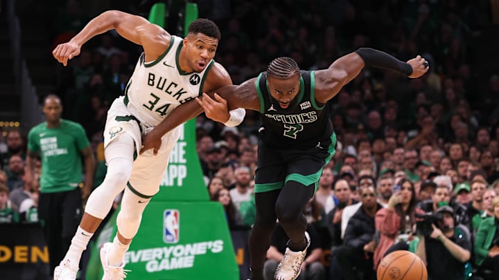 Nov 22, 2023; Boston, Massachusetts, USA; Milwaukee Bucks forward Giannis Antetokounmpo (34) and Boston Celtics forward Jaylen Brown (7) fight for the ball during the second half at TD Garden. Mandatory Credit: Paul Rutherford-Imagn Images