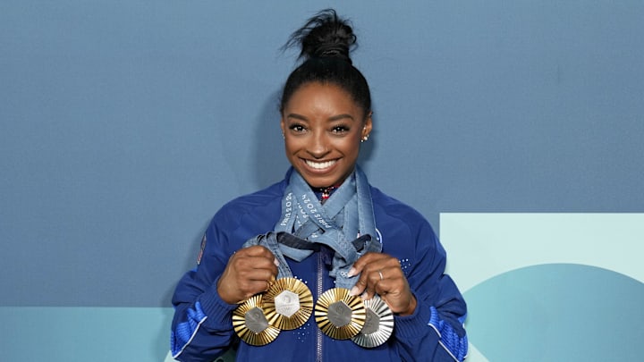 Aug 5, 2024; Paris, France; Simone Biles of the United States poses for a photo with her three gold and one silver medal after day three of the gymnastics event finals during the Paris 2024 Olympic Summer Games. Mandatory Credit: Kyle Terada-Imagn Images