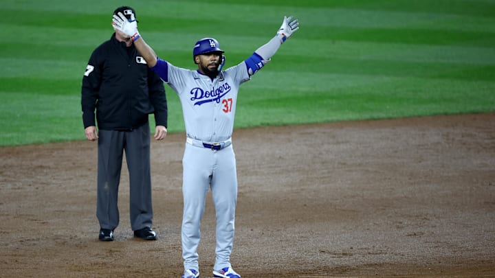 Oct 30, 2024; New York, New York, USA; Los Angeles Dodgers outfielder Teoscar Hernandez (37) celebrates after hitting a two-RBI double during the fifth inning against the New York Yankees in game five of the 2024 MLB World Series at Yankee Stadium. Mandatory Credit: Wendell Cruz-Imagn Images
