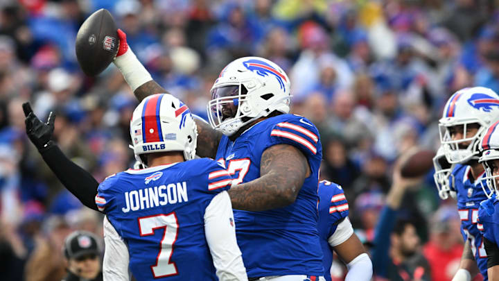 Dec 29, 2024; Orchard Park, New York, USA; Buffalo Bills defensive tackle Jordan Phillips (97) reacts to getting an interception against the New York Jets in the second quarter at Highmark Stadium.