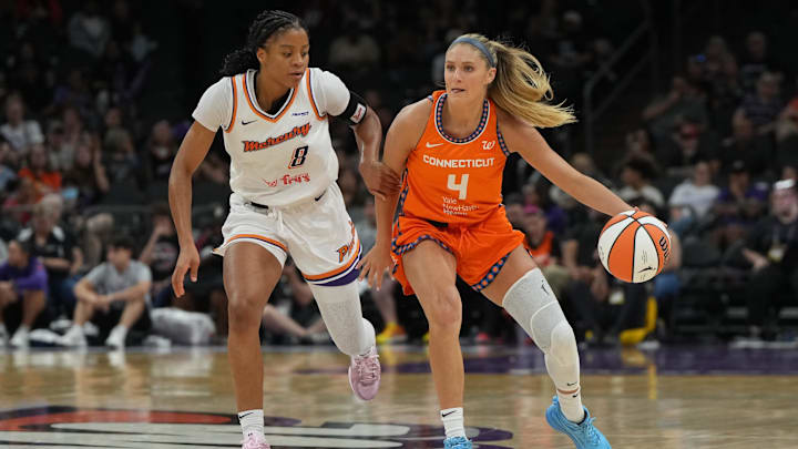 Aug 5, 2025; Phoenix, Arizona, USA; Connecticut Sun guard Jacy Sheldon (4) drives around Phoenix Mercury guard Monique Akoa Makani (8) in the second half at Footprint Center. Mandatory Credit: Rick Scuteri-Imagn Images Aug 5, 2025; Phoenix, Arizona, USA; Connecticut Sun guard Jacy Sheldon (4) drives around Phoenix Mercury guard Monique Akoa Makani (8) in the second half at Footprint Center. Mandatory Credit: Rick Scuteri-Imagn Images