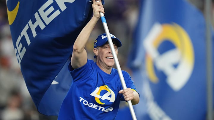 Los Angeles Rams flags are waved after they score a touchdown against the Minnesota Vikings during their playoff game at State Farm Stadium on Jan. 13, 2025, in Glendale.
