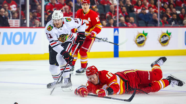 Apr 4, 2023; Calgary, Alberta, CAN; Calgary Flames defenseman Nikita Zadorov (16) checks the puck