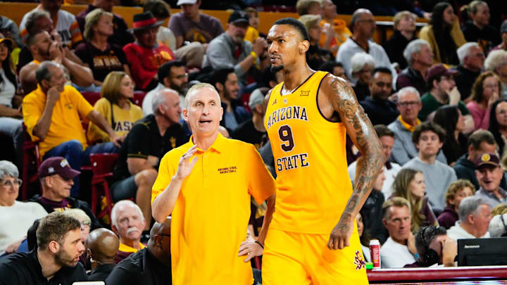 Former Arizona State Sun Devils center Shawn Phillips Jr. (9) talks to his head coach Bobby Hurley, in a game against the Texas Tech Red Raiders last season.