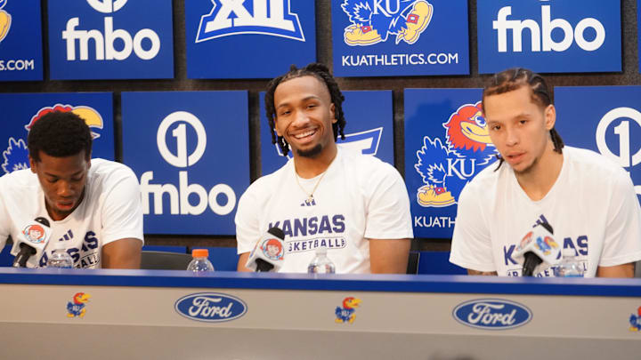 Kansas Jayhawks guard Melvin Council Jr. (14), Kansas Jayhawks guard Darryn Peterson (22) and Kansas Jayhawks guard Tre White (3) talks to the media following the game against Houston Cougars inside Allen Fieldhouse on Monday, Feb. 23, 2026.