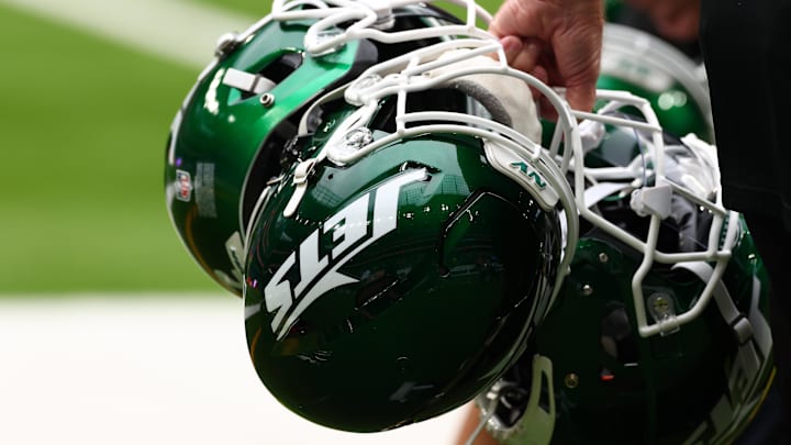 Oct 6, 2024; Tottenham, ENG; New York Jets helmets are held by staff before the match against Minnesota Vikings at Tottenham Hotspur Stadium. Mandatory Credit: Shaun Brooks-Imagn Images