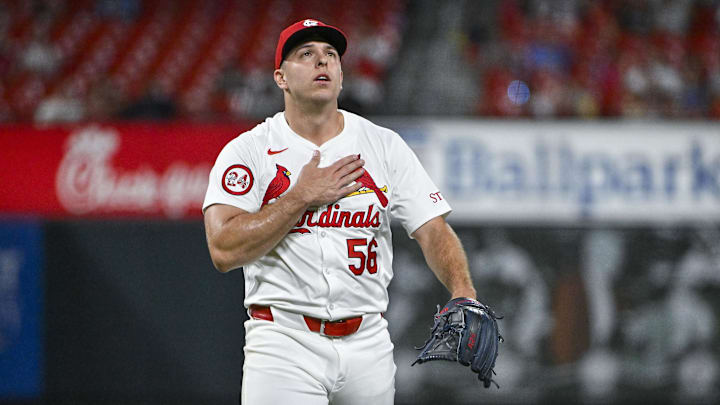 Aug 28, 2024; St. Louis, Missouri, USA;  St. Louis Cardinals relief pitcher Ryan Helsley (56) reacts after striking out San Diego Padres third baseman Manny Machado (not pictured) during the ninth inning at Busch Stadium. Mandatory Credit: Jeff Curry-Imagn Images