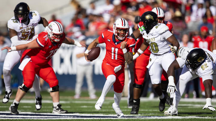 Oct 19, 2024; Tucson, Arizona, USA; Arizona Wildcats quarterback Noah Fifita (11) against the Colorado Buffalos at Arizona Stadium. Mandatory Credit: Mark J. Rebilas-Imagn Images Oct 19, 2024; Tucson, Arizona, USA; Arizona Wildcats quarterback Noah Fifita (11) against the Colorado Buffalos at Arizona Stadium. Mandatory Credit: Mark J. Rebilas-Imagn Images