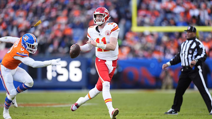 Jan 5, 2025; Denver, Colorado, USA; Kansas City Chiefs quarterback Carson Wentz (11) looks to pass the ball in the second quarter against the Denver Broncos at Empower Field at Mile High. Mandatory Credit: Ron Chenoy-Imagn Images
