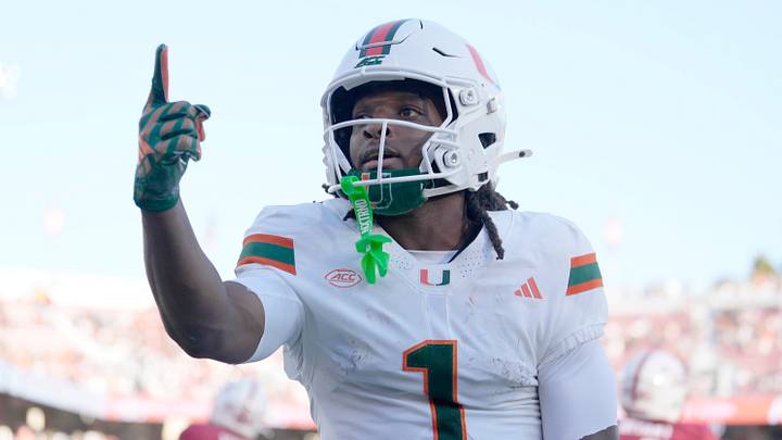 Sep 4, 2026; Stanford, California, USA;  Miami Hurricanes wide receiver Malachi Toney (1) reacts towards the stands after scoring a touchdown against the Stanford Cardinal during the first quarter at Stanford Stadium.  Mandatory Credit: Stan Szeto-Imagn Images