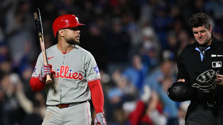 Apr 22, 2026; Chicago, Illinois, USA; Philadelphia Phillies catcher Rafael Marchan (13) reacts after striking out, to a challenged and overturned pitch, to end the game against the Chicago Cubs as home plate umpire John Bacon (70) looks on at Wrigley Field. Mandatory Credit: Patrick Gorski-Imagn Images Apr 22, 2026; Chicago, Illinois, USA; Philadelphia Phillies catcher Rafael Marchan (13) reacts after striking out, to a challenged and overturned pitch, to end the game against the Chicago Cubs as home plate umpire John Bacon (70) looks on at Wrigley Field. Mandatory Credit: Patrick Gorski-Imagn Images