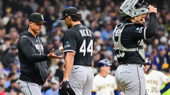Mar 26, 2026; Milwaukee, Wisconsin, USA;  Chicago White Sox manager Will Venable tales the ball from pitcher Jordan Hicks (44) as catcher Edgar Quero (26) looks on during a pitching change in the sixth inning against the Milwaukee Brewers at American Family Field. Mandatory Credit: Benny Sieu-Imagn Images