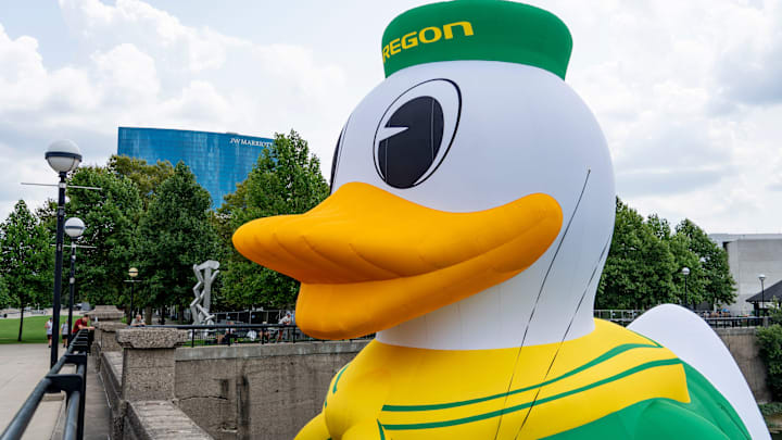 An inflatable of the University of Oregon Duck mascot floats on the White River in front of the NCAA Headquarters on Tuesday, July 23, 2024, in downtown Indianapolis. The float weighs in at 1,600 pounds and takes 1.5 hours to inflate.