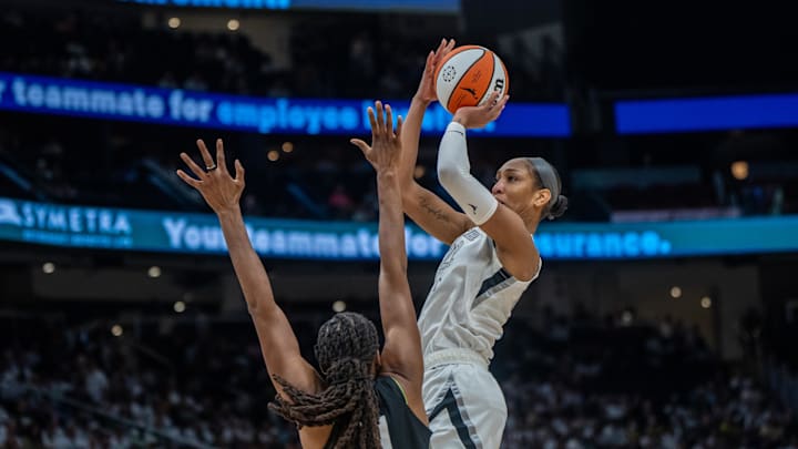 Sep 16, 2025; Seattle, Washington, USA; Las Vegas Aces center A'ja Wilson (22) shoots the ball against Seattle Storm forward Nneka Ogwumike (3) during the second half in game two of round one for the 2025 WNBA Playoffs at Climate Pledge Arena. Mandatory Credit: Stephen Brashear-Imagn Images