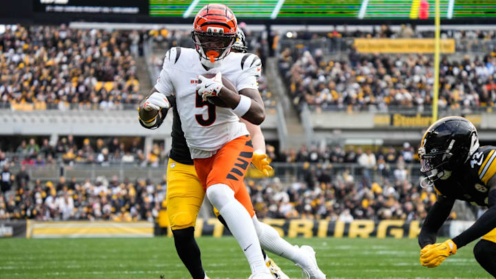 Bengals Tee Higgins (5) takes the ball down the field during their game against the Steelers on Sunday November 16, 2025 at Acrisure Stadium.