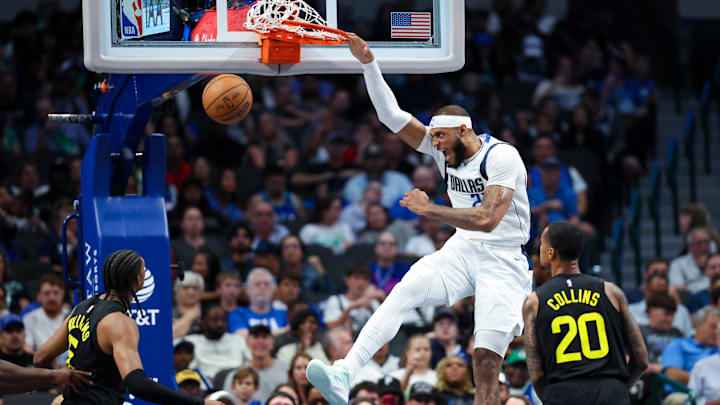 Oct 10, 2024; Dallas, Texas, USA;  Dallas Mavericks center Daniel Gafford (21) dunks during the second half against the Utah Jazz at American Airlines Center. Mandatory Credit: Kevin Jairaj-Imagn Images
