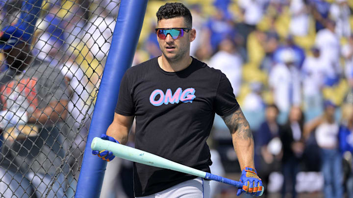 Oct 14, 2024; Los Angeles, California, USA; New York Mets second baseman Jose Iglesias (11) warms up before game two against the Los Angeles Dodgers in the NLCS for the 2024 MLB Playoffs at Dodger Stadium. Mandatory Credit: Jayne Kamin-Oncea-Imagn Images
