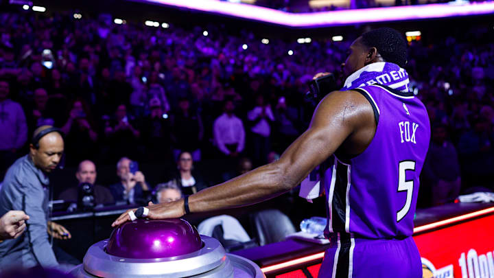 Jan 22, 2025; Sacramento, California, USA; Sacramento Kings guard De'Aaron Fox (5) lights the beam in celebration of their victory against the Golden State Warriors at Golden 1 Center. Mandatory Credit: Sergio Estrada-Imagn Images