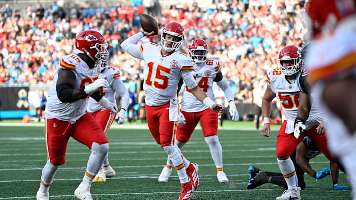 Nov 24, 2024; Charlotte, North Carolina, USA; Kansas City Chiefs quarterback Patrick Mahomes (15) throws a touchdown pass in the third quarter at Bank of America Stadium. Mandatory Credit: Bob Donnan-Imagn Images