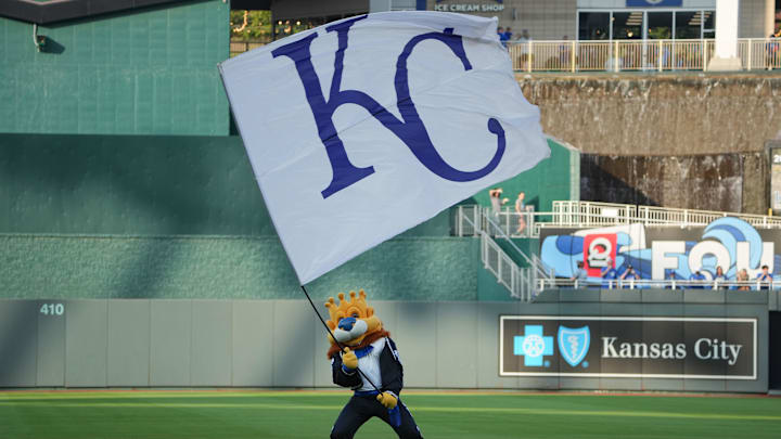 Sep 6, 2025; Kansas City, Missouri, USA; The Kansas City Royals mascot Sluggerrr waves a large flag prior to a game between the Kansas City Royals and Minnesota Twins at Kauffman Stadium. Mandatory Credit: Denny Medley-Imagn Images