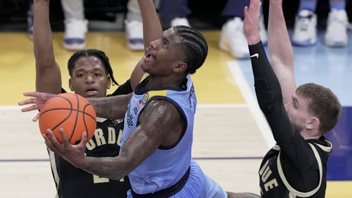 Marquette guard Kam Jones (1) scores during the second half of their game Tuesday, November 19, 2024 at Fiserv Forum in Milwaukee, Wisconsin. Marquette beat Purdue 76-58. Marquette guard Kam Jones (1) scores during the second half of their game Tuesday, November 19, 2024 at Fiserv Forum in Milwaukee, Wisconsin. Marquette beat Purdue 76-58.