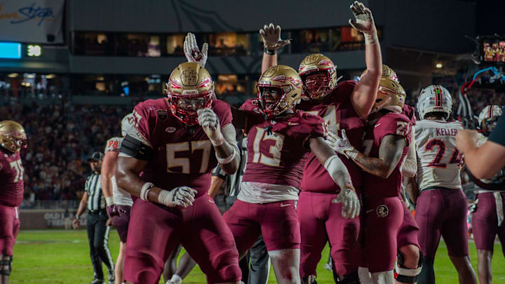 Junior tight end Randy Pittman celebrates a score alongisde senior offensive lineman Micah Pettus in FSU's matchup against Virginia Tech on Nov. 15.