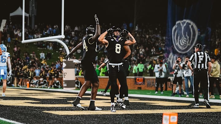 Nov 15, 2025; Winston-Salem, North Carolina, USA; Wake Forest Demon Deacons wide receiver Carlos Hernandez (8) reacts after a play against the North Carolina Tar Heels at Allegacy Federal Credit Union Stadium. Mandatory Credit: Wake Forest Athletics via Imagn Images