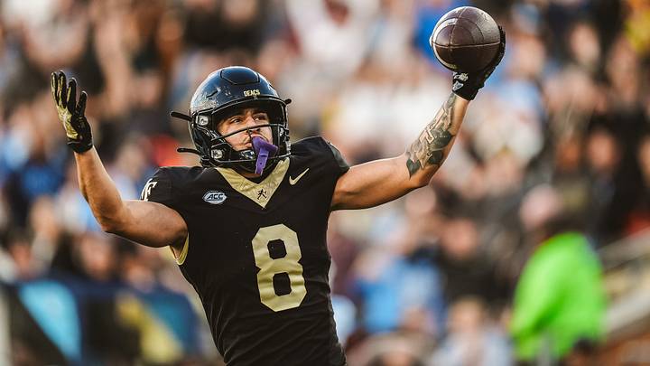 Nov 15, 2025; Winston-Salem, North Carolina, USA; Wake Forest Demon Deacons wide receiver Carlos Hernandez (8) reacts after a play against the North Carolina Tar Heels at Allegacy Federal Credit Union Stadium. Mandatory Credit: Wake Forest Athletics via Imagn Images Nov 15, 2025; Winston-Salem, North Carolina, USA; Wake Forest Demon Deacons wide receiver Carlos Hernandez (8) reacts after a play against the North Carolina Tar Heels at Allegacy Federal Credit Union Stadium. Mandatory Credit: Wake Forest Athletics via Imagn Images