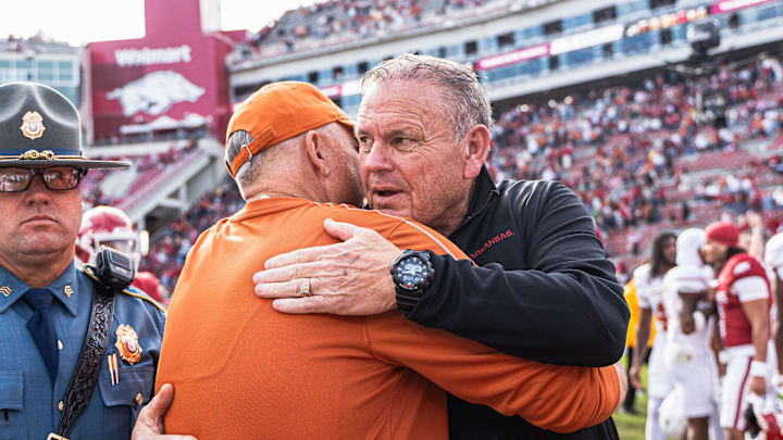 Arkansas coach Sam Pittman and Texas coach Steve Sarkisian meet postgame after the Longhorns defeat the Razorbacks 20-10.