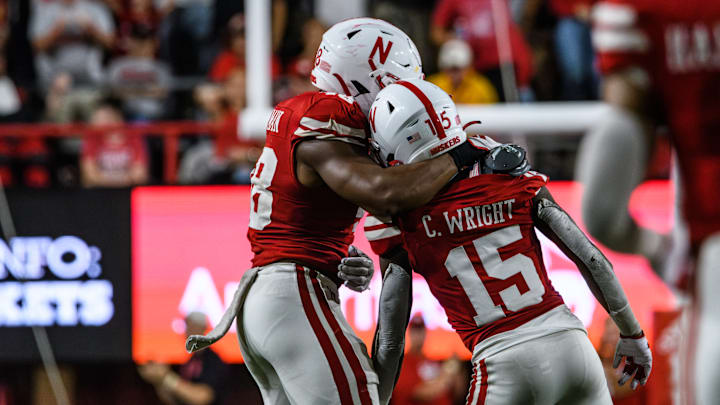 MJ Sherman (left) hugs Ceyair Wright (15) after Wright's strip-sack for Nebraska to recover a fumble in the third quarter. MJ Sherman (left) hugs Ceyair Wright (15) after Wright's strip-sack for Nebraska to recover a fumble in the third quarter.