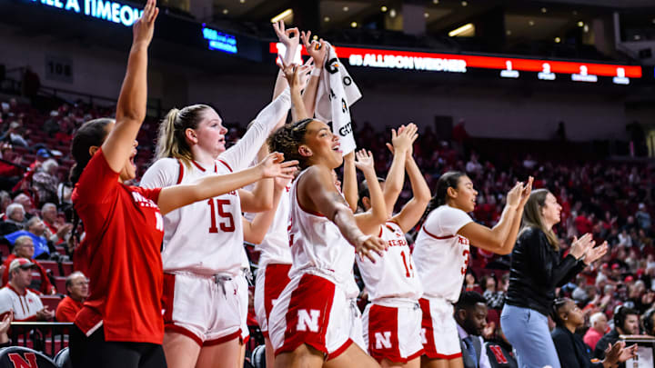 The Husker bench celebrates a three pointer from Logan Nissley. The Husker bench celebrates a three pointer from Logan Nissley.