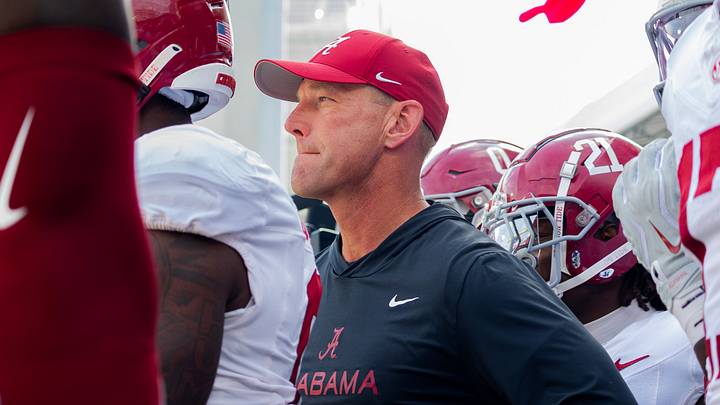 Alabama head coach Kalen DeBoer prepares to run out before the game against Mississippi State on Oct 3, 2026.