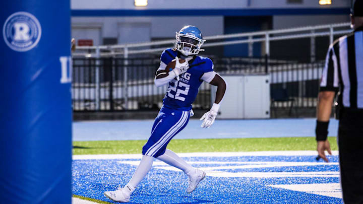Tranard Roberts finds the end zone for IMG. Tranard Roberts finds the end zone for IMG.