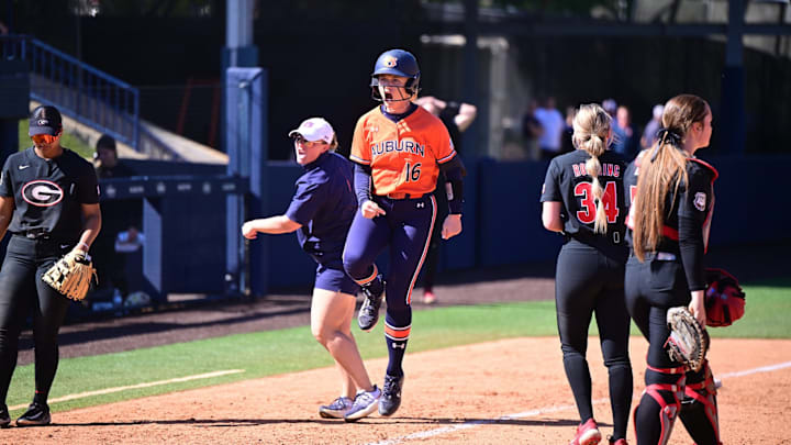 Auburn softball's KK McCrary rounds third base and skips home after hitting a walk-off grand slam on April 13, 2025.