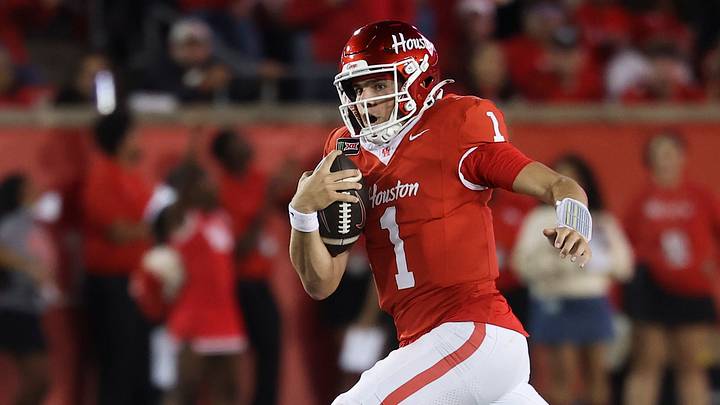 Oct 17, 2026; Houston, Texas, USA; Houston Cougars quarterback Conner Weigman (1) runs with the ball past Oklahoma State Cowboys linebacker Isaiah Chisom (2) during the third quarter at TDECU Stadium. Mandatory Credit: Troy Taormina-Imagn Images