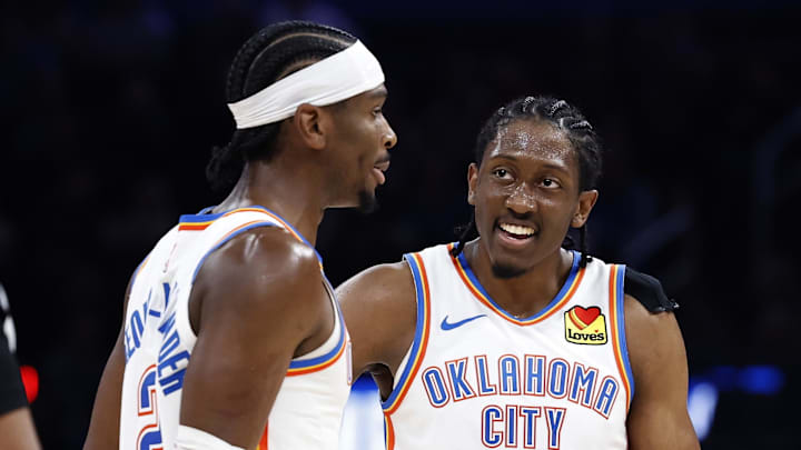 Nov 20, 2024; Oklahoma City, Oklahoma, USA; Oklahoma City Thunder forward Jalen Williams (8) and guard Shai Gilgeous-Alexander (2) talk during a time out against the Portland Trail Blazers at Paycom Center.
