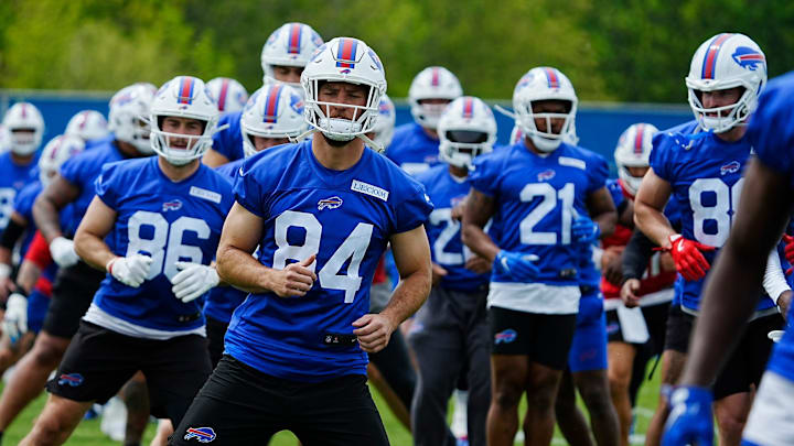 Buffalo Bills TE Zach Davidson, center, and teammates go through stretches during a voluntary workout at their practice facility in Orchard Park.