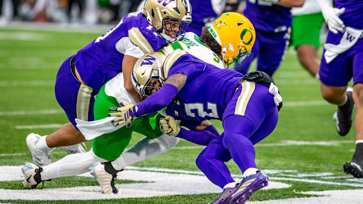 Rahshawn Clark (2) lowers his shoulder into an Oregon player. 