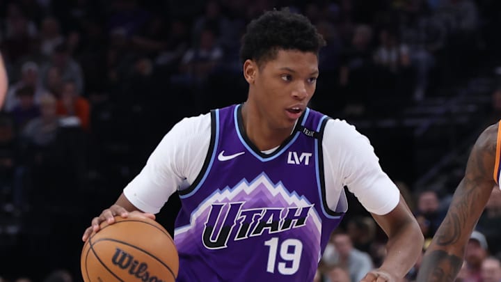 Oct 27, 2025; Salt Lake City, Utah, USA; Utah Jazz guard Ace Bailey (19) drives against Phoenix Suns forward Royce O'Neale (00) during the second half at Delta Center. Mandatory Credit: Rob Gray-Imagn Images