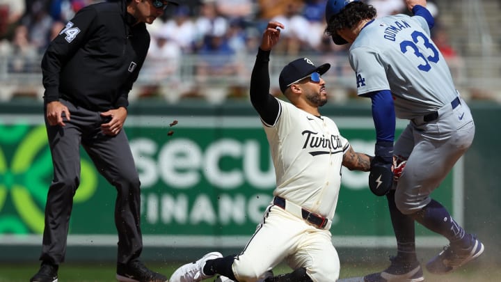 Apr 10, 2024; Minneapolis, Minnesota, USA; Minnesota Twins shortstop Carlos Correa (4) tags out Los