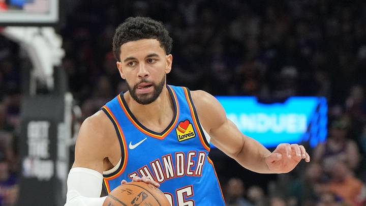 Apr 25, 2026; Phoenix, Arizona, USA; Oklahoma City Thunder guard Ajay Mitchell (25) drives against the Phoenix Suns in the first half during game three of the first round of the 2026 NBA Playoffs at Mortgage Matchup Center. Mandatory Credit: Rick Scuteri-Imagn Images