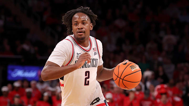 Mar 15, 2024; New York City, NY, USA; Connecticut Huskies guard Tristen Newton (2) brings the ball