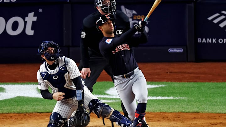 Oct 14, 2024; Bronx, New York, USA; Cleveland Guardians shortstop Brayan Rocchio (4) hits a solo home run during the sixth inning against the New York Yankees in game one of the ALCS for the 2024 MLB Playoffs at Yankee Stadium. Mandatory Credit: Vincent Carchietta-Imagn Images