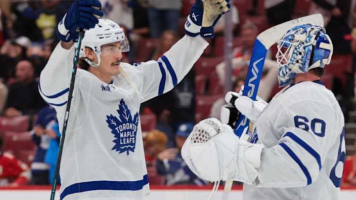 Dec 2, 2025; Sunrise, Florida, USA; Toronto Maple Leafs defenseman Philippe Myers (51) celebrates with goaltender Joseph Woll (60) after the game against the Florida Panthers at Amerant Bank Arena. Mandatory Credit: Sam Navarro-Imagn Images