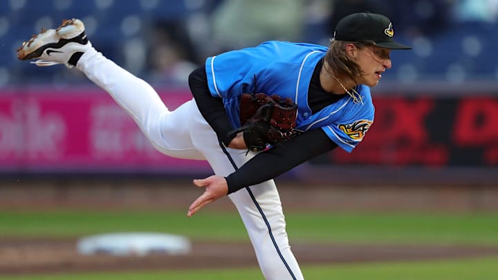 Akron RubberDucks pitcher Doug Nikhazy (29) follows through on a pitch during the first inning of an opening-day baseball game against the Altoona Curve at Canal Park, Friday, April 5, 2024, in Akron, Ohio.
